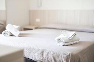 Postel nebo postele na pokoji v ubytování Hotel Primiana