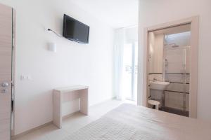 Koupelna v ubytování Hotel Primiana + 37 fotografií