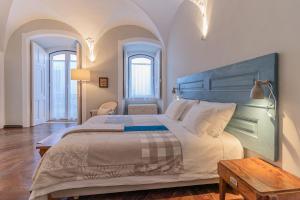 Ένα ή περισσότερα κρεβάτια σε δωμάτιο στο CASA d’OLIVENÇA +132 φωτογραφίες