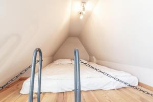 Łóżko lub łóżka w pokoju w obiekcie Apartament Gdański Gród