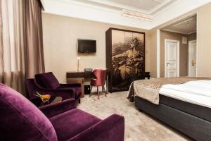 Postel nebo postele na pokoji v ubytování Elite Plaza Hotel