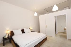 Łóżko lub łóżka w pokoju w obiekcie Stylische Cityapartments Benedikt