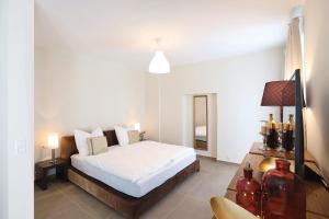 Łóżko lub łóżka w pokoju w obiekcie Stylische Cityapartments Benedikt