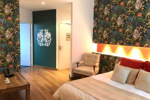 Postel nebo postele na pokoji v ubytování Château De Siran - Hôtel & Spa