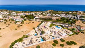 an aerial view of a beach with buildings and the ocean at Villa Rafaella II Palace by Atlantic Places in Albufeira