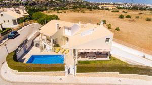 an aerial view of a house with a swimming pool at Villa Rafaella II Palace by Atlantic Places in Albufeira