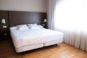 Posteľ alebo postele v izbe v ubytovaní Balneario de Mondariz