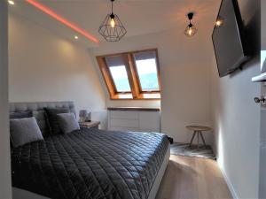 Posteľ alebo postele v izbe v ubytovaní VIP Apartamenty Centrum Przy Równi