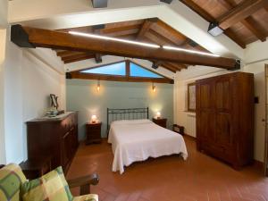 a bedroom with a white bed and a window at Agriturismo Tenuta Badia in Paciano +238 photos