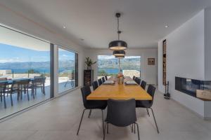 a dining room with a large wooden table and chairs at Sea Star Villa - Vinjerac in Vinjerac
