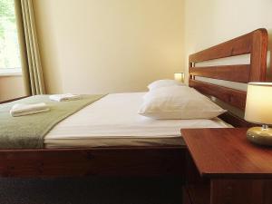 Postel nebo postele na pokoji v ubytování Nowa Fregata - pokoje nad morzem