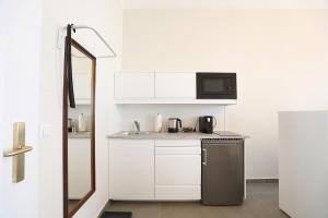 Kuchnia lub aneks kuchenny w obiekcie Stylische Cityapartments Benedikt