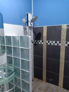 a bathroom with a glass sink and a shower at Pakdeehouse Homestay in Phra Nakhon Si Ayutthaya