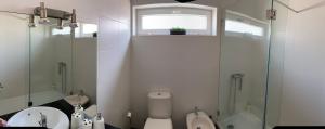 a bathroom with a sink and a toilet and a shower at Casa Oliveira in Vila do Conde +16 photos