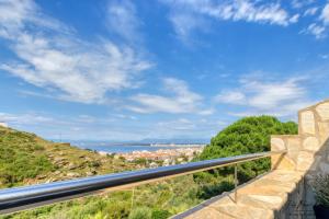 a balcony with a view of the water at Sanne in Roses