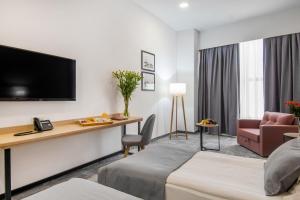TV in/ali zabaviščno središče v nastanitvi Hotel Split Inn by President