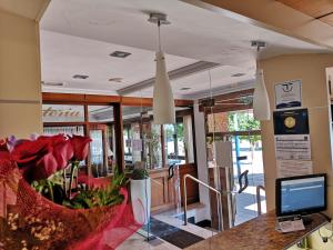 a lobby of a store with a computer on a counter at Hotel Ribera in Santiago de la Ribera