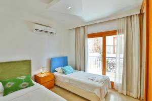 Cama o camas de una habitación en Çınarlar Apart Hotel KAŞ