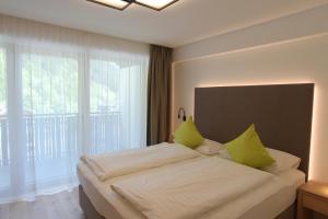 Ένα ή περισσότερα κρεβάτια σε δωμάτιο στο Appartments Hopfgartner Eurospar