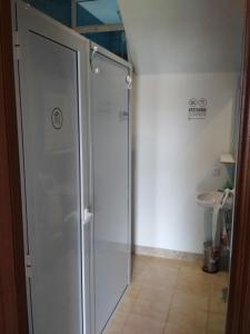 a bathroom with a shower and a toilet at Casa Do Marabillas in Portomarin +42 photos