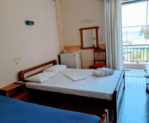 Postel nebo postele na pokoji v ubytování Hotel Ionio