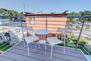 Balkón nebo terasa v ubytování Pod Winogronem - Apartamenty z basenem i wyżywieniem