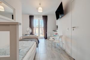 Postel nebo postele na pokoji v ubytování Pod Winogronem - Apartamenty z basenem i wyżywieniem