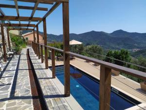a view from the balcony of a villa with a swimming pool at L'Antico Borgo B&B in Levanto