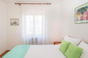 Posteľ alebo postele v izbe v ubytovaní Apartments Palmic