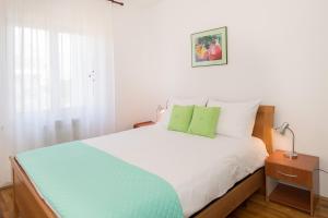 Posteľ alebo postele v izbe v ubytovaní Apartments Palmic