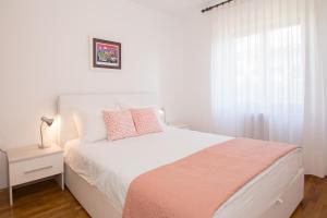 Posteľ alebo postele v izbe v ubytovaní Apartments Palmic