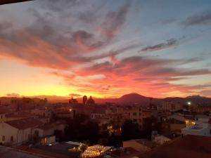 a view of a city at sunset at Marysel Rooms in Olbia