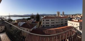 a view of a city with buildings and a bridge at Marysel Rooms in Olbia