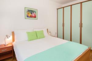 Posteľ alebo postele v izbe v ubytovaní Apartments Palmic