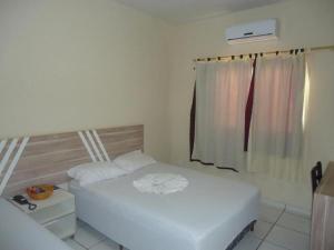 Postel nebo postele na pokoji v ubytování Recife Palace Hotel