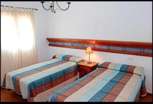 Ένα ή περισσότερα κρεβάτια σε δωμάτιο στο Apartamento Goya 7