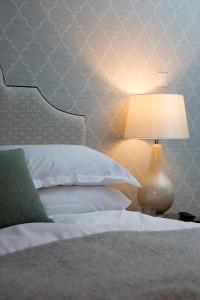 A bed or beds in a room at Tickton Grange Hotel 