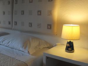 A bed or beds in a room at LI PIREDDI