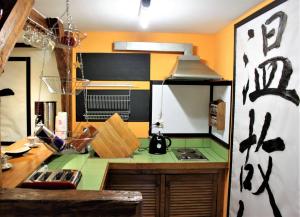 a kitchen with a green counter top and a stove at PrivOffice4U Samurai - Old Town, Main Square, Main station in Krakow