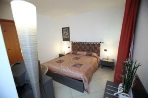 Postel nebo postele na pokoji v ubytování B&B Ca' Loi