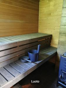 a sauna with two pots and pans on a shelf at Hamina Camping Pitkäthiekat in Hamina