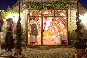 a woman is standing in a greenhouse with plants at Domaine de Gayfié in Salvagnac-Cajarc +253 photos