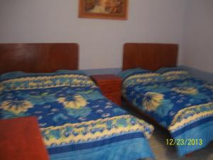 Postel nebo postele na pokoji v ubytování Hostal Eclipse Oaxaca
