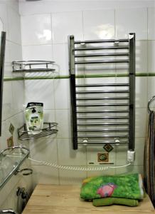 a bathroom with a table with a green pillow on it at PrivOffice4U Samurai - Old Town, Main Square, Main station in Krakow