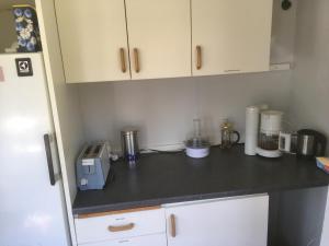 a kitchen with a counter top with a blender at SovPå Tåg i Tärnsjö in Tärnsjö +14 photos