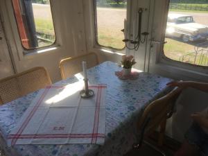 a table in a room with a candle on it at SovPå Tåg i Tärnsjö in Tärnsjö