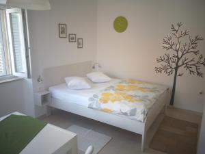 Кровать или кровати в номере Apartment Punat