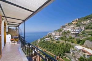 a balcony with a view of the ocean at Casa Scirocco in Positano