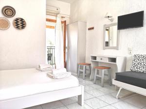 A bed or beds in a room at Emilia Apartments