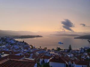 a view of a city and a body of water at Villa Muses in Poros